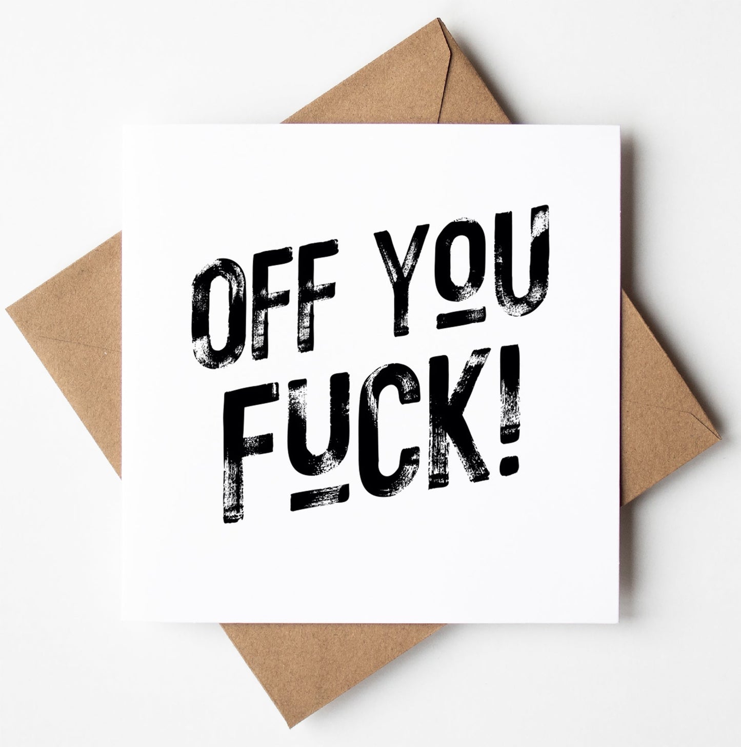 The "Off You Fuck Then! Harlem Card" features bold black text on a white card with a brown envelope, ideal for those in search of a cheeky congratulations card. It is packaged in a biodegradable bag and available for worldwide shipping.