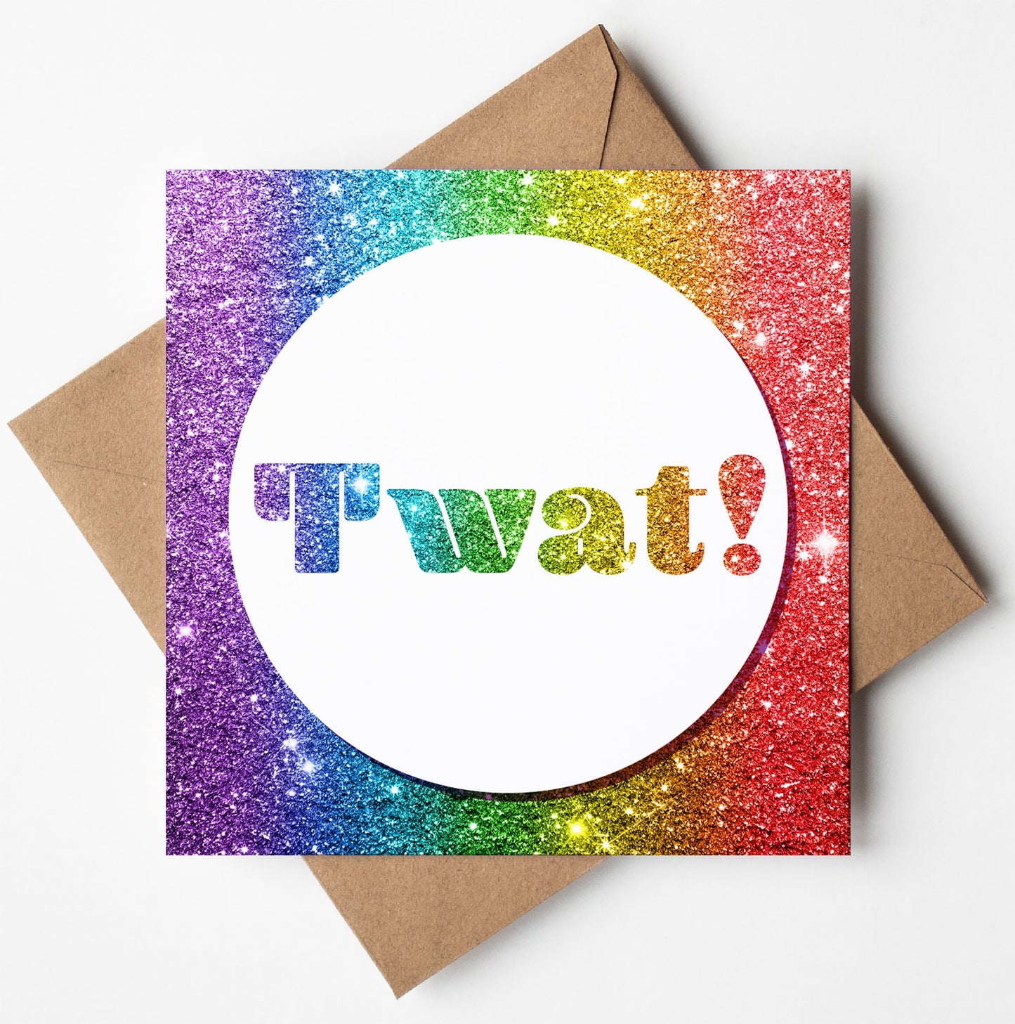 The Twat! Funny Insult Card features a colorful design with a sparkly rainbow glitter border. The center showcases a white circle with "Twat!" in glittery letters, adding adult humor. A brown envelope is included.