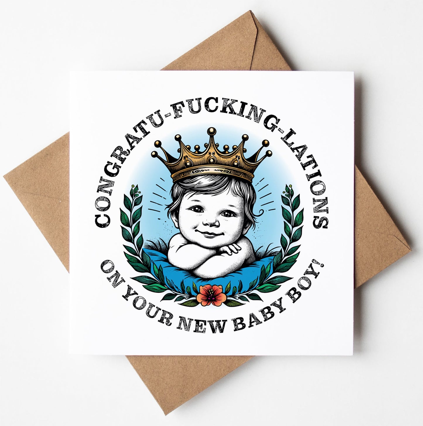 Featuring an illustration of a smiling baby boy wearing a crown, surrounded by laurel leaves and a flower, the card boldly proclaims, "Congratu-fucking-lations on your new baby boy!" Set against a plain background, it comes with a brown envelope. This is the Congratu-fucking-lations On Your New Baby Boy! Crown Card.