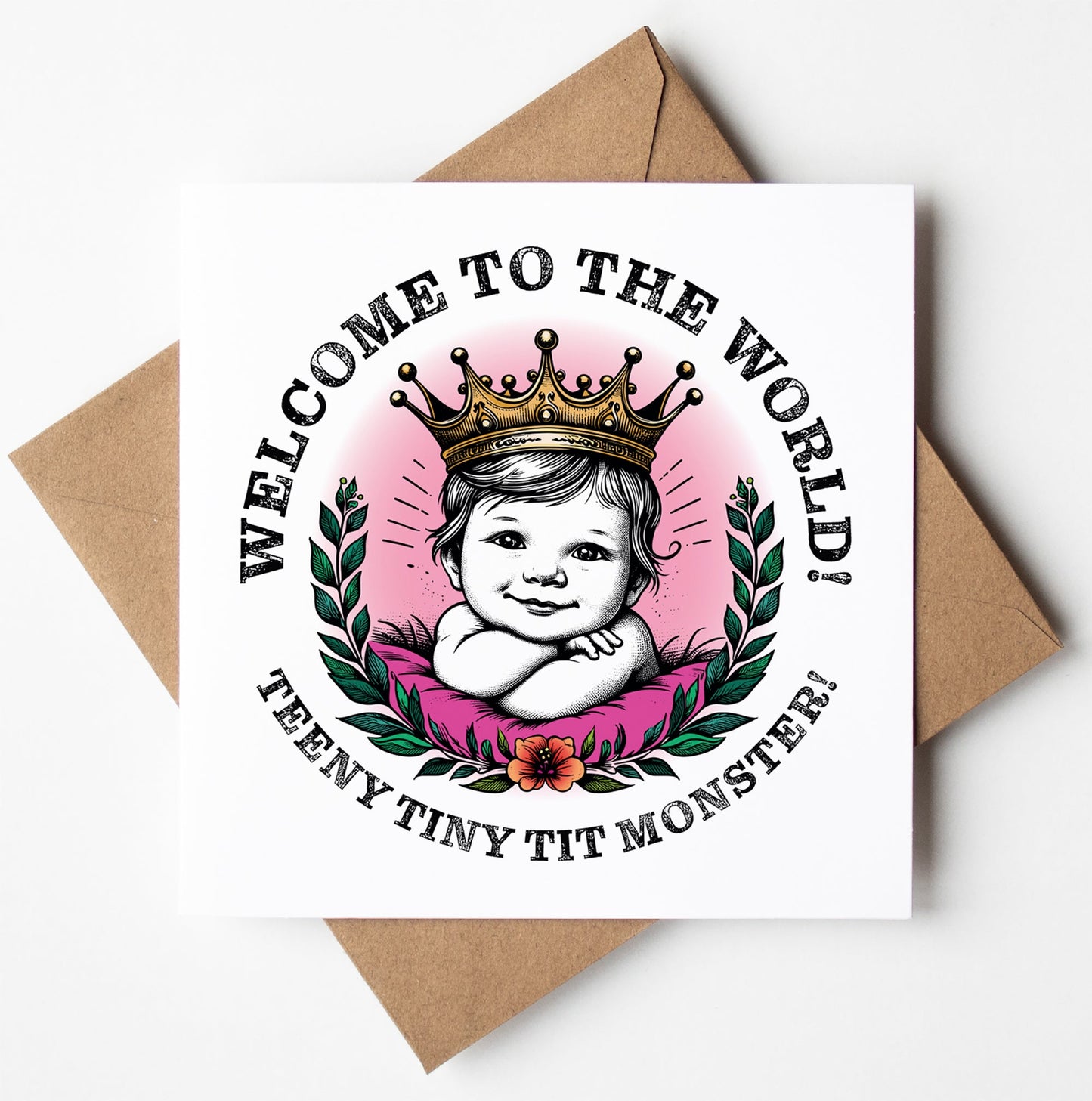 Greeting card titled "Welcome To The World Teeny Tiny Tit Monster!" featuring a cute illustration of a baby girl wearing a crown, surrounded by laurel wreaths and flowers. Includes the text: "Welcome to the World! Teeny Tiny Tit Monster!" This charming typographic greeting card is paired with a brown envelope.