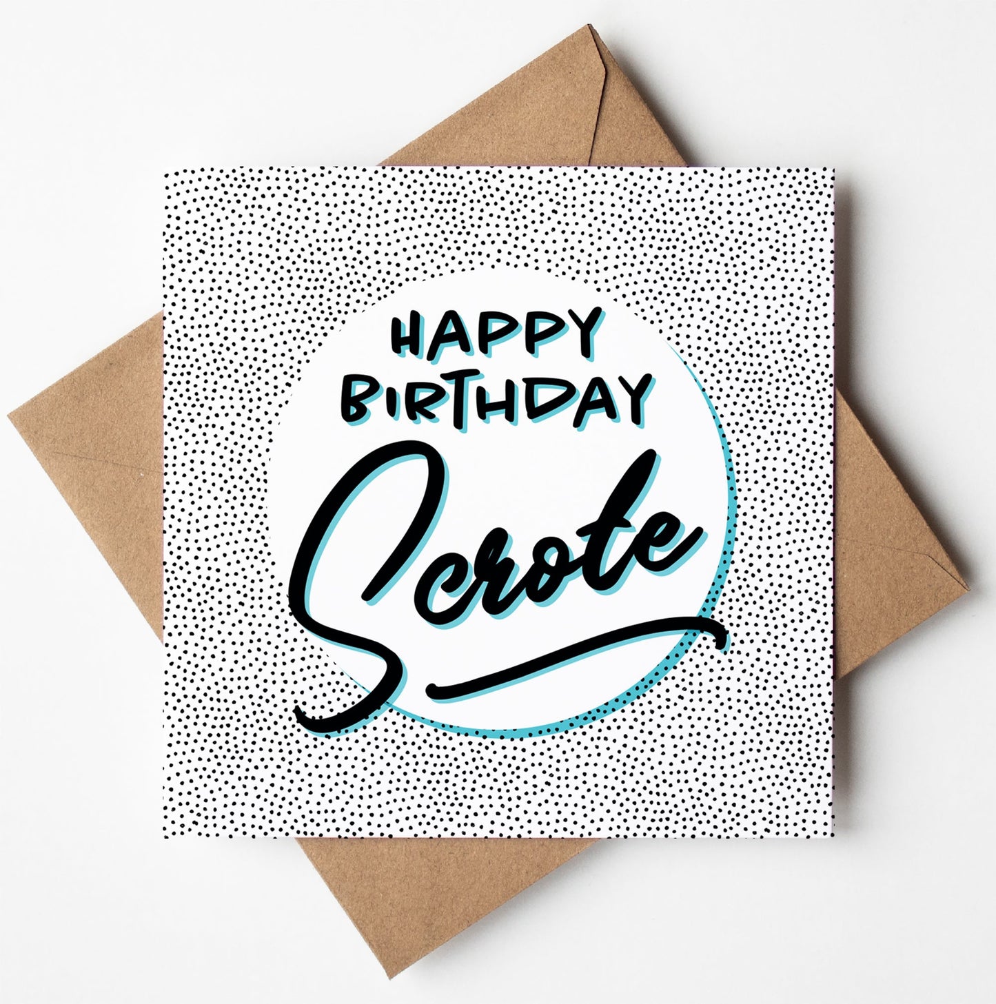 The Happy Birthday Scrote Card showcases a stylish black and white polka dot design, with eye-catching bold black and teal lettering set against the lively pattern. It includes a brown envelope and offers worldwide shipping, all while being eco-friendly due to its biodegradable materials.