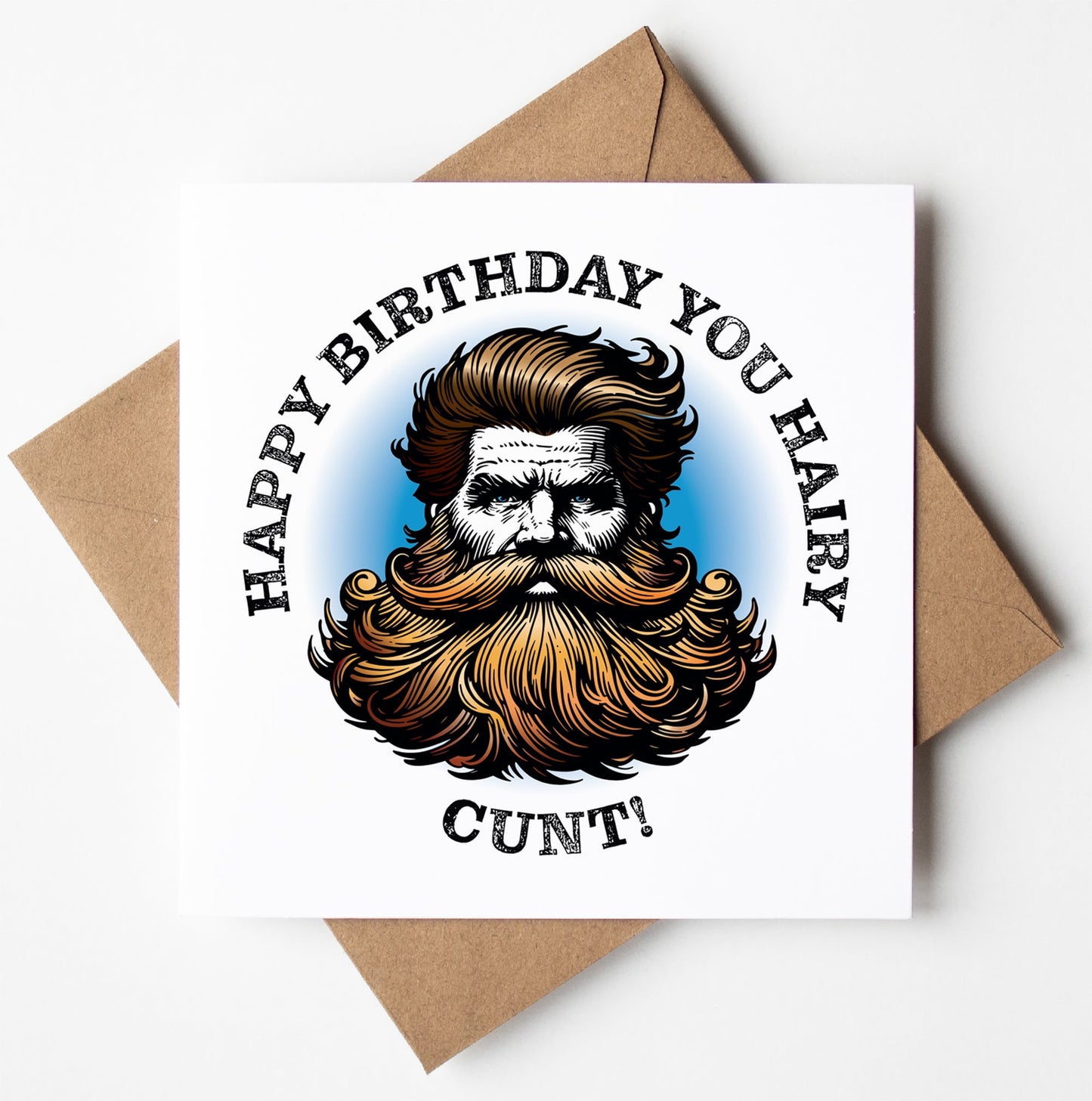 A square greeting card titled "Happy Birthday You Hairy Cunt! Blonde Card," crafted in Wales, comes with a brown envelope and showcases an illustration of a man with a thick beard and styled hair. The text around the image reads "Happy Birthday You Hairy Cunt!" against a white background with a blue halo effect.