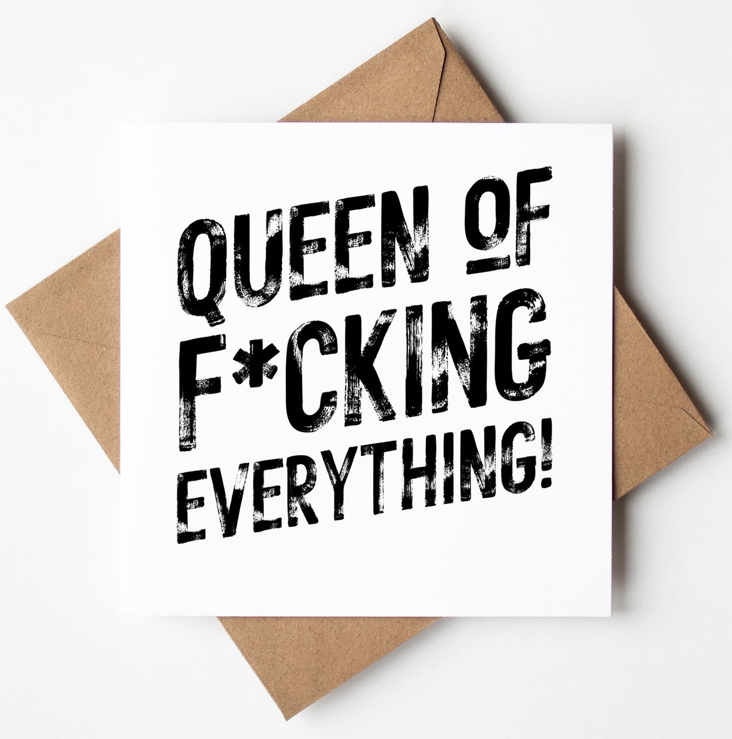 The Queen of F*cking Everything! Harlem Card features bold black text on a square card, paired with a brown envelope. Blank inside, it’s perfect for adding your personal birthday message.