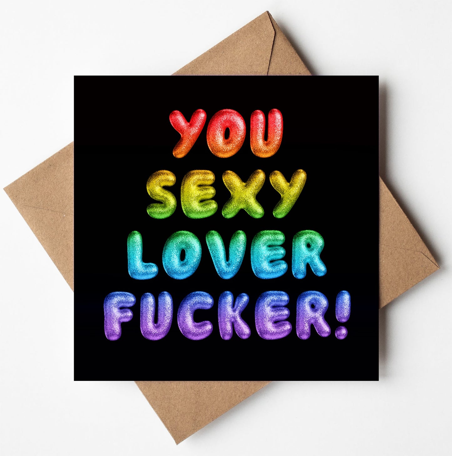 The "You Sexy Lover Fucker! Rainbow Font Card" features vibrant, balloon-style text on a black background. The words shine in bold gradient colors like red, orange, green, blue, and purple. Arranged in a square format with an envelope included, it's perfect for expressing bold affection.