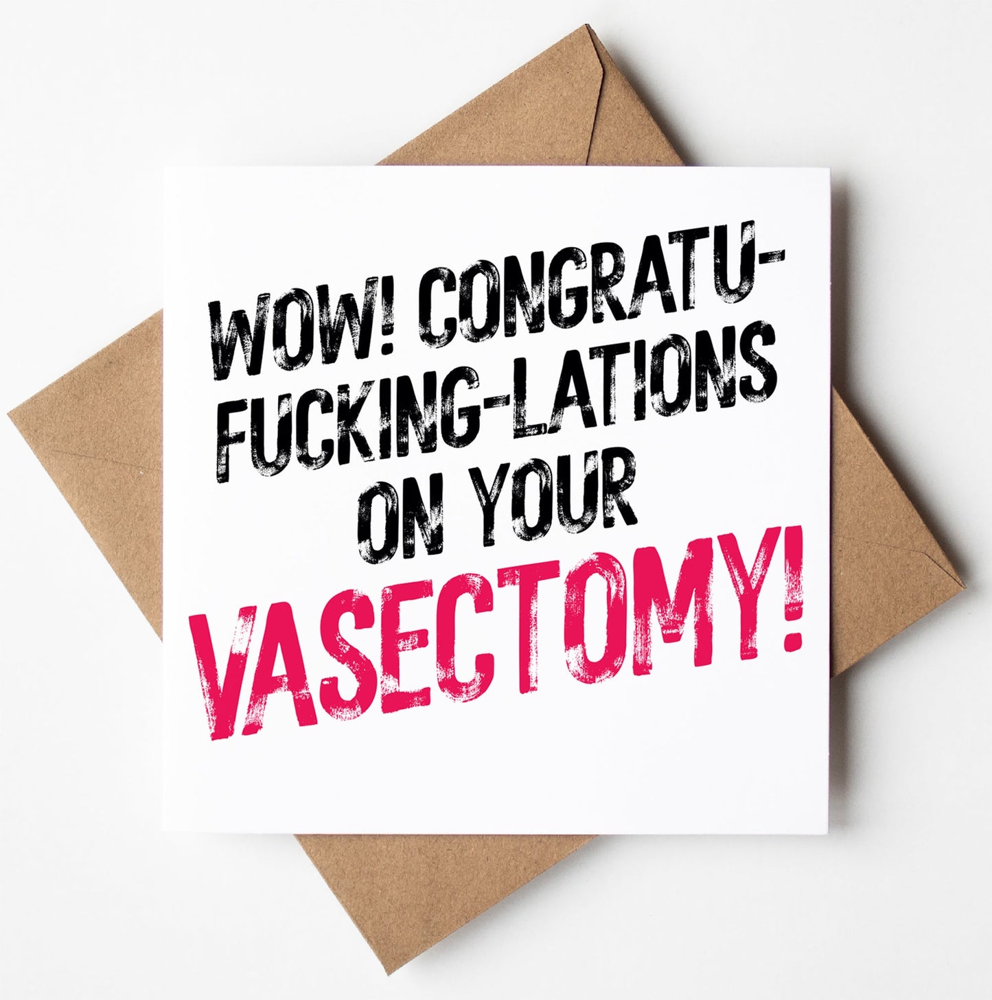 The Harlem Card features bold black and pink text exclaiming, "Congratu-fucking-lations on your vasectomy!" It rests atop a plain brown envelope against a white background.