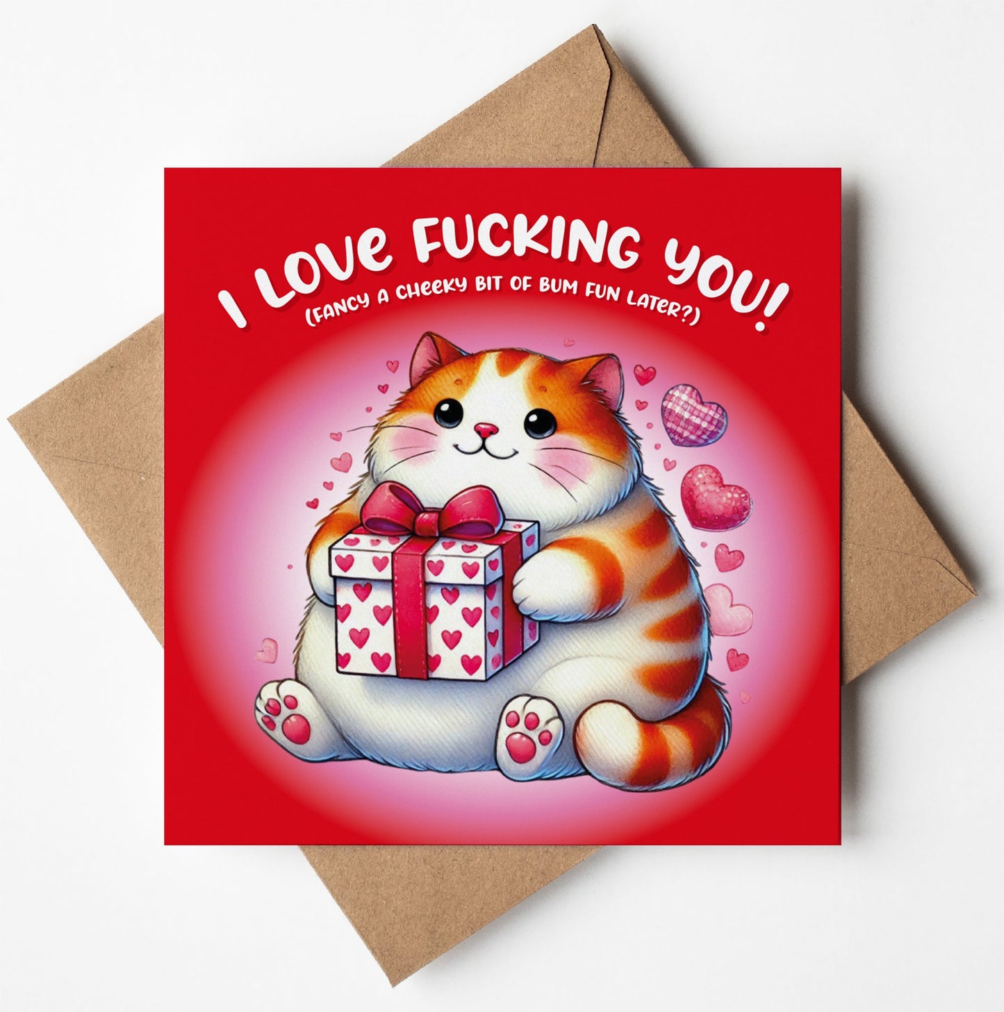 The "I Love Fucking You! Cute Kitten Card" features a chubby cartoon cat holding a heart-patterned gift on a red background with pink hearts. The text says, "I LOVE YOU! (FANCY A CHEEKY BIT OF FUN LATER?)". Comes with a brown envelope; perfect for Valentine's Day.