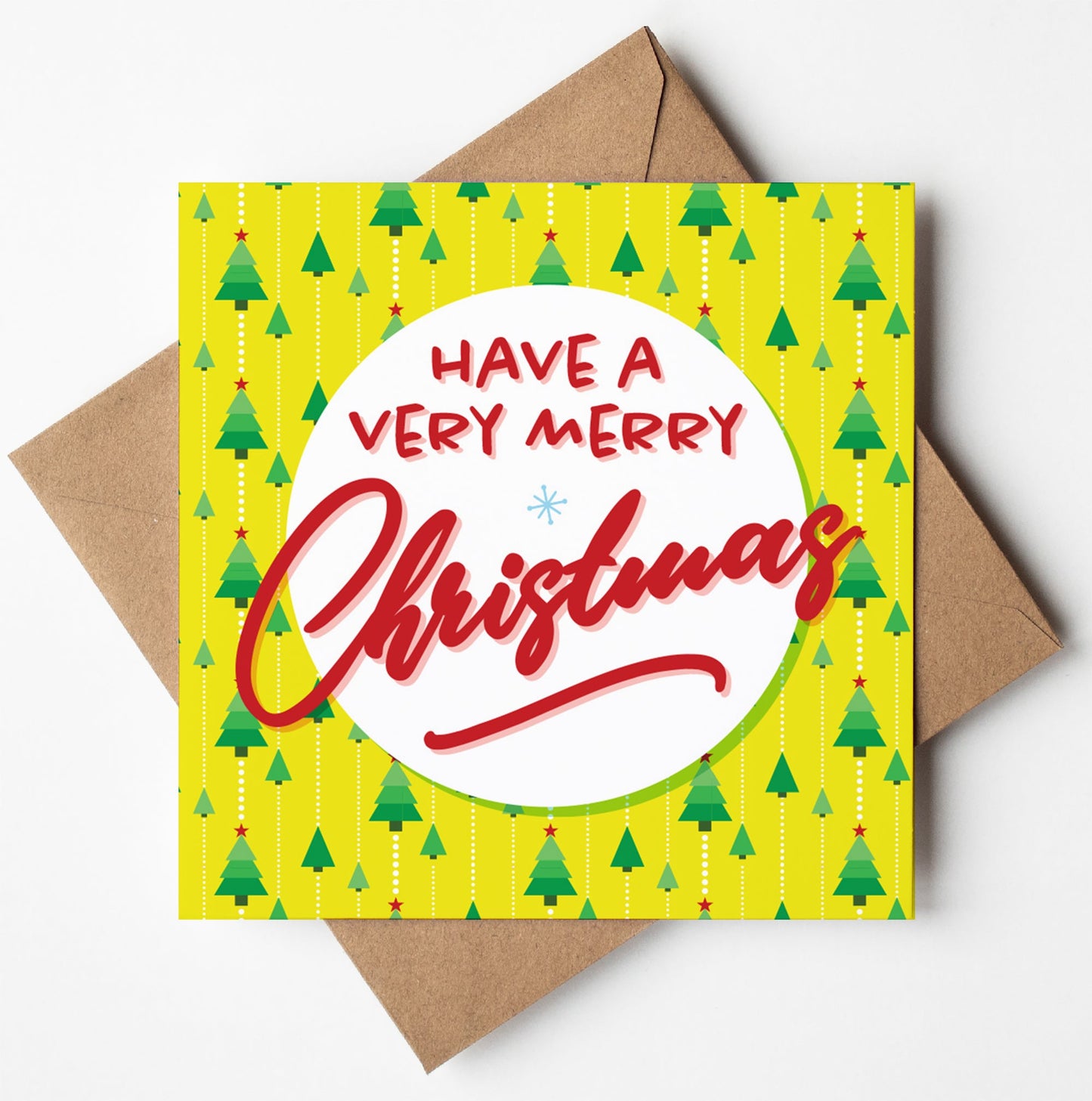 The Very Merry Modern Tree Xmas Card features a stylish yellow background with contemporary Christmas trees decorated with red ornaments. The message "Have a Very Merry Christmas" is gracefully written in red and white. The card is accompanied by a brown envelope, beautifully embodying the festive spirit.