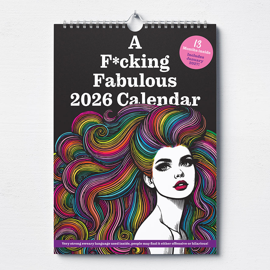 A bold A4 2026 calendar cover shows a black-and-white woman with long rainbow hair. "A F*cking Fabulous Calendar" is printed in white, and a pink sticker notes 13 months, including January 2027. EARLYBIRD 20% OFF!.