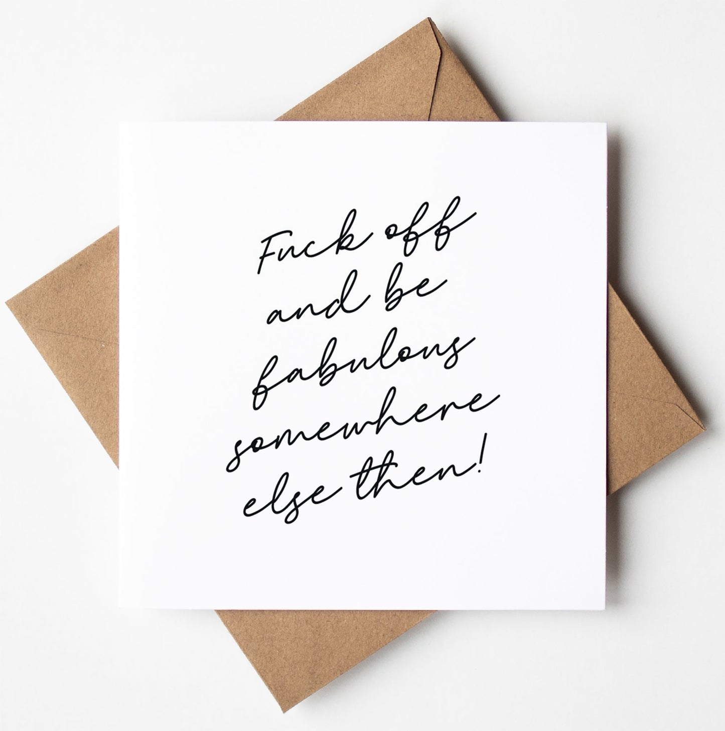The "Fuck Off and Fabulous Script Card," with its minimalist design and handwritten message, elegantly rests on a brown envelope, making it perfect for sending off in a biodegradable bag.