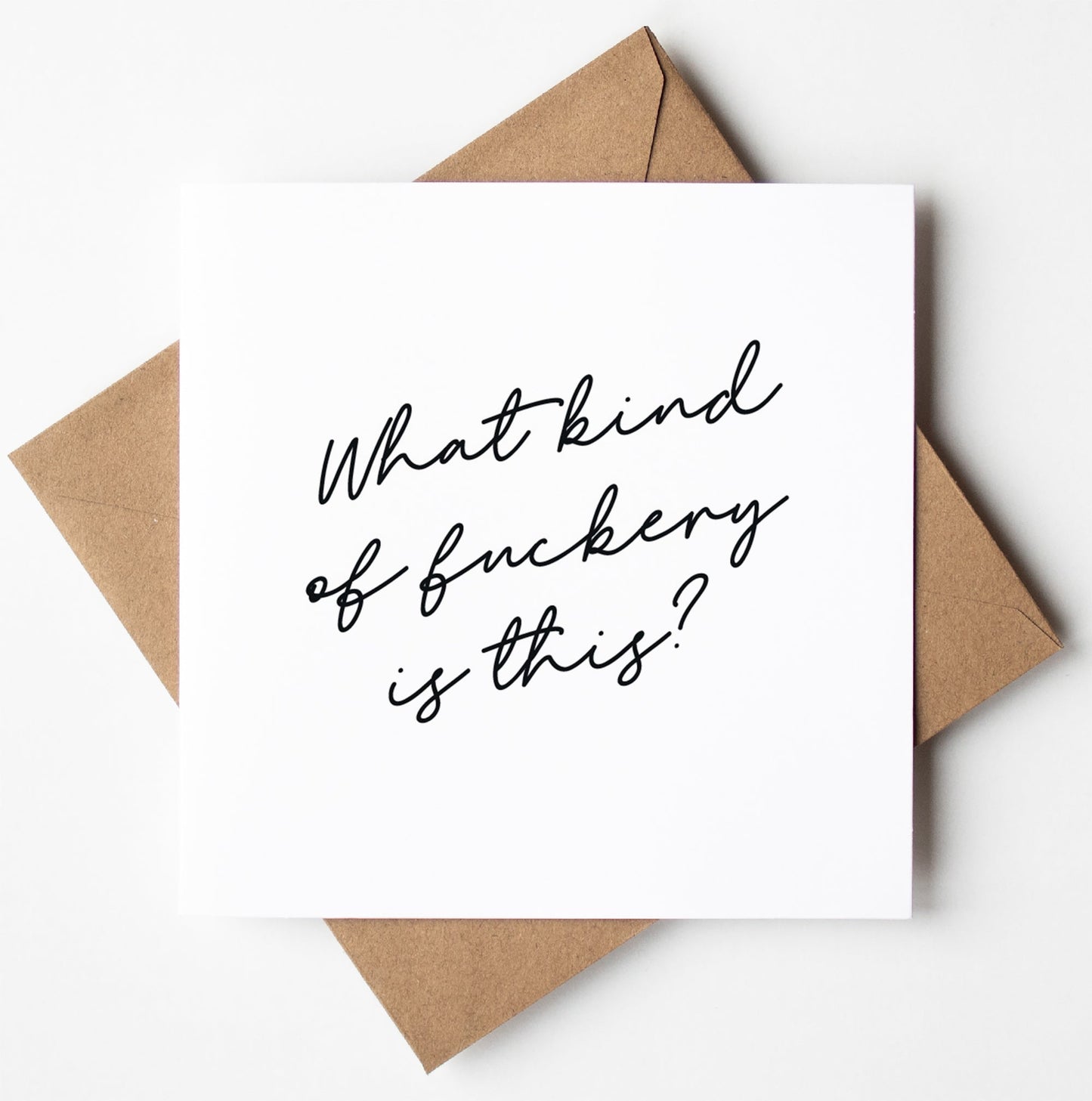 The What Kind Of Fuckery Is This? Script Card is a square white card featuring stylish black script text that reads, "What kind of fuckery is this?" It comes with a brown envelope and is ready for worldwide shipping.