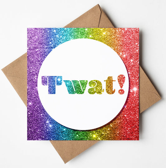 The Twat! Funny Insult Card features a colorful design with a sparkly rainbow glitter border. The center showcases a white circle with "Twat!" in glittery letters, adding adult humor. A brown envelope is included.