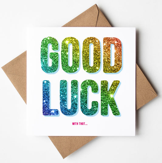 A perfect funny retirement card, the "Good Luck With That Card" features "GOOD LUCK" in large, colorful glitter letters on a white backdrop, followed by the humorous phrase "WITH THAT..." in smaller pink text. The card is complemented by a neatly paired brown envelope.