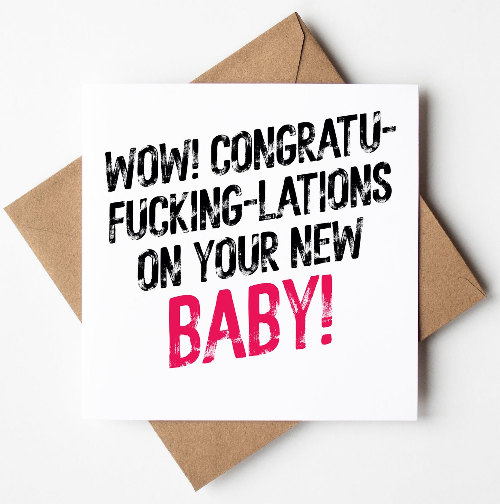 The "Congrats On Your New Baby! Harlem Card" features bold text that humorously reads, "Wow! Congratufuckinglations on your new baby!" with the word "baby" highlighted in pink. Designed in Wales, the card is set on a brown envelope.