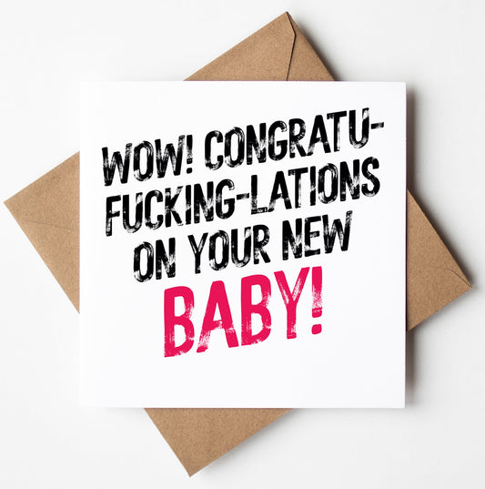 The "Congrats On Your New Baby! Harlem Card" features bold text that humorously reads, "Wow! Congratufuckinglations on your new baby!" with the word "baby" highlighted in pink. Designed in Wales, the card is set on a brown envelope.
