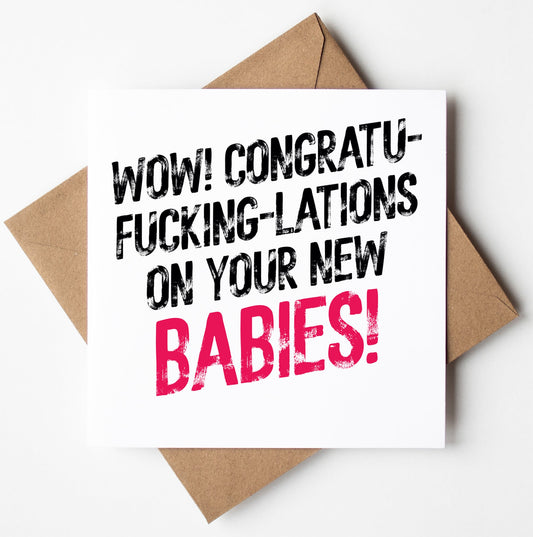 The Congrats On Your New Babies! Twins Harlem Card features bold pink "BABIES!" text on a brown envelope—an unforgettable typographic congratulations card for new twins.