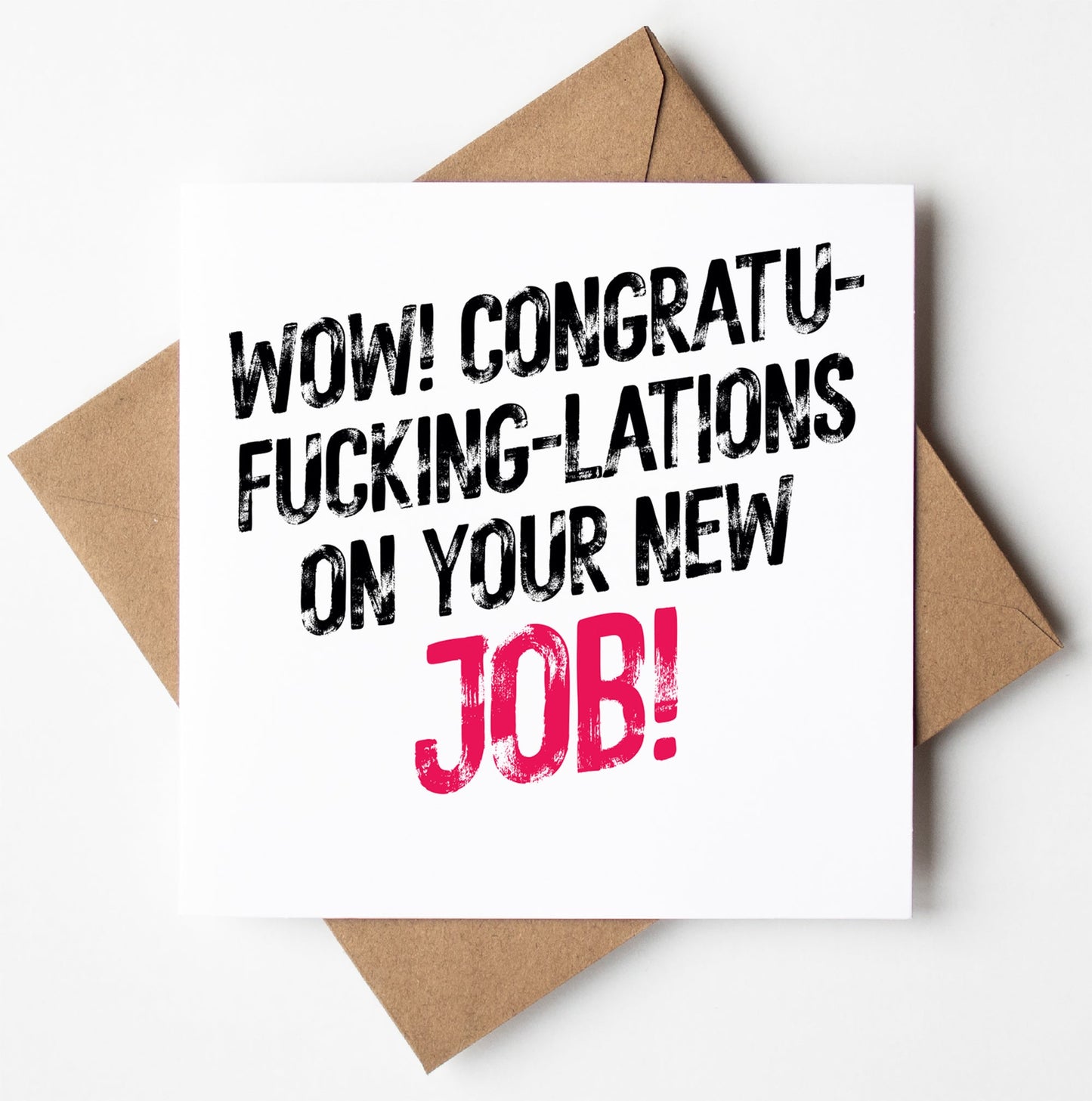 The "Congratu-fucking-lations On Your New Job! Harlem Card" is a square congratulations card with "WOW! CONGRATU-FUCKING-LATIONS ON YOUR NEW JOB!" in bold black text, featuring "JOB!" in bold pink. It is presented on a brown envelope against a white background.
