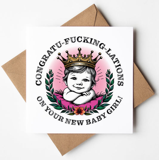 This sweary greetings card, titled "Congratu-fucking-lations On Your New Baby Girl! Crown Card," showcases a drawing of a baby girl adorned with a crown, set amidst leaves and flowers on a pink background. The bold text boldly exclaims "CONGRATU-FUCKING-LATIONS ON YOUR NEW BABY GIRL!" making it an ideal choice for celebrating the arrival of a new baby girl. It comes neatly paired with a brown envelope.