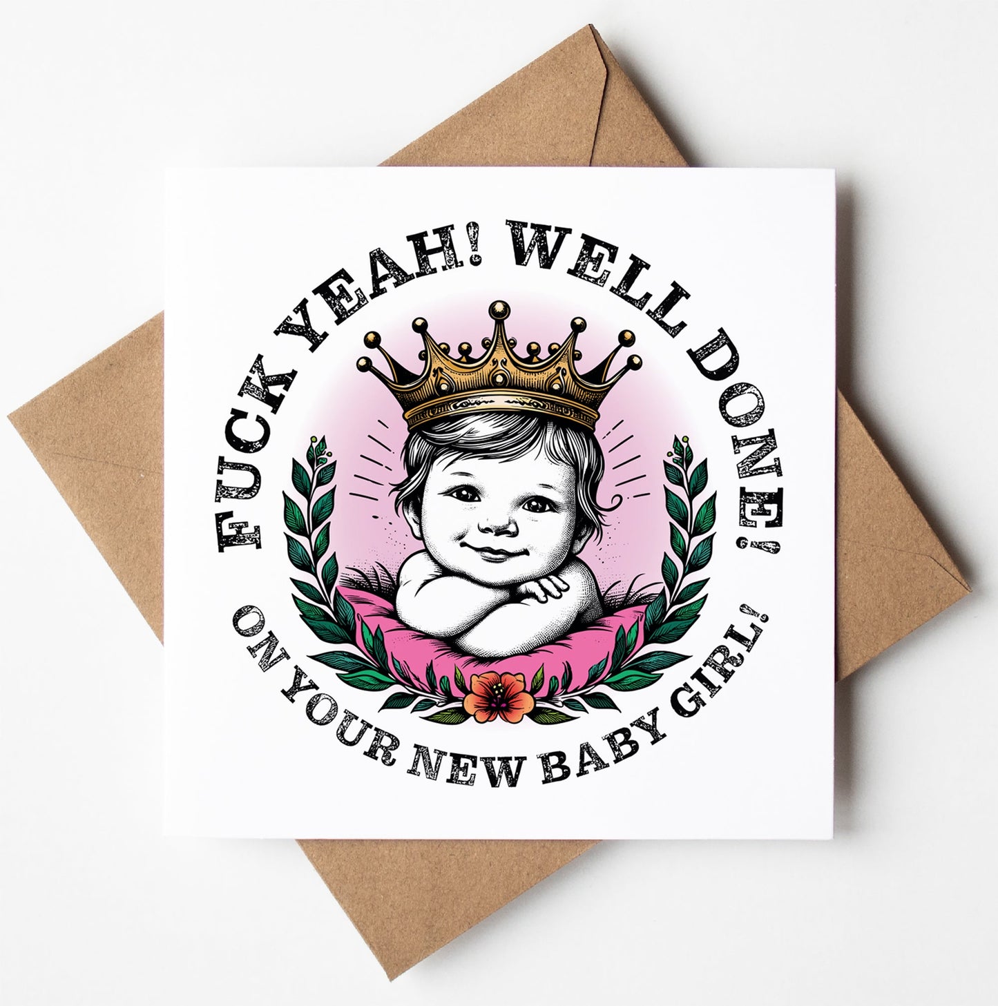 A congratulatory card titled "Fuck Yeah! Well Done! New Baby Girl!" showcases a baby donning a crown, encircled by laurel leaves and a flower, alongside bold text proclaiming, "F* Yeah! Well Done! On Your New Baby Girl!" This expressive greetings card is paired with a brown envelope.