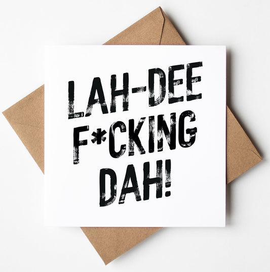 The Lah-Dee F*cking Dah! Harlem Card features bold black text on a white card, paired with a brown envelope. Perfect for any occasion, this unique greetings card ships worldwide.
