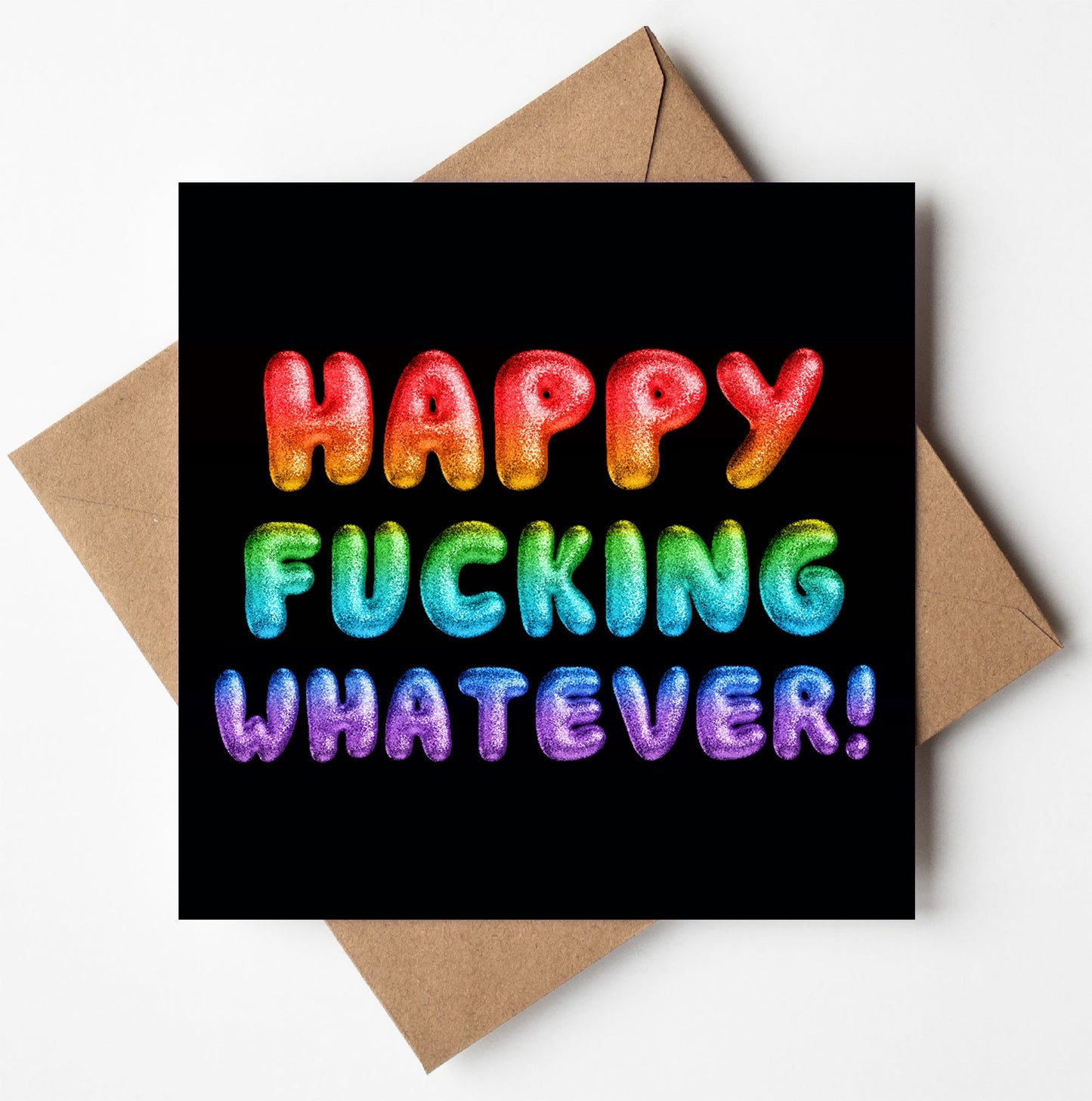 The "Happy Fucking Whatever! Rainbow Font Card" features bright balloon-like rainbow text on a sleek black background and comes with a brown envelope—perfect for sending sweary celebration vibes.