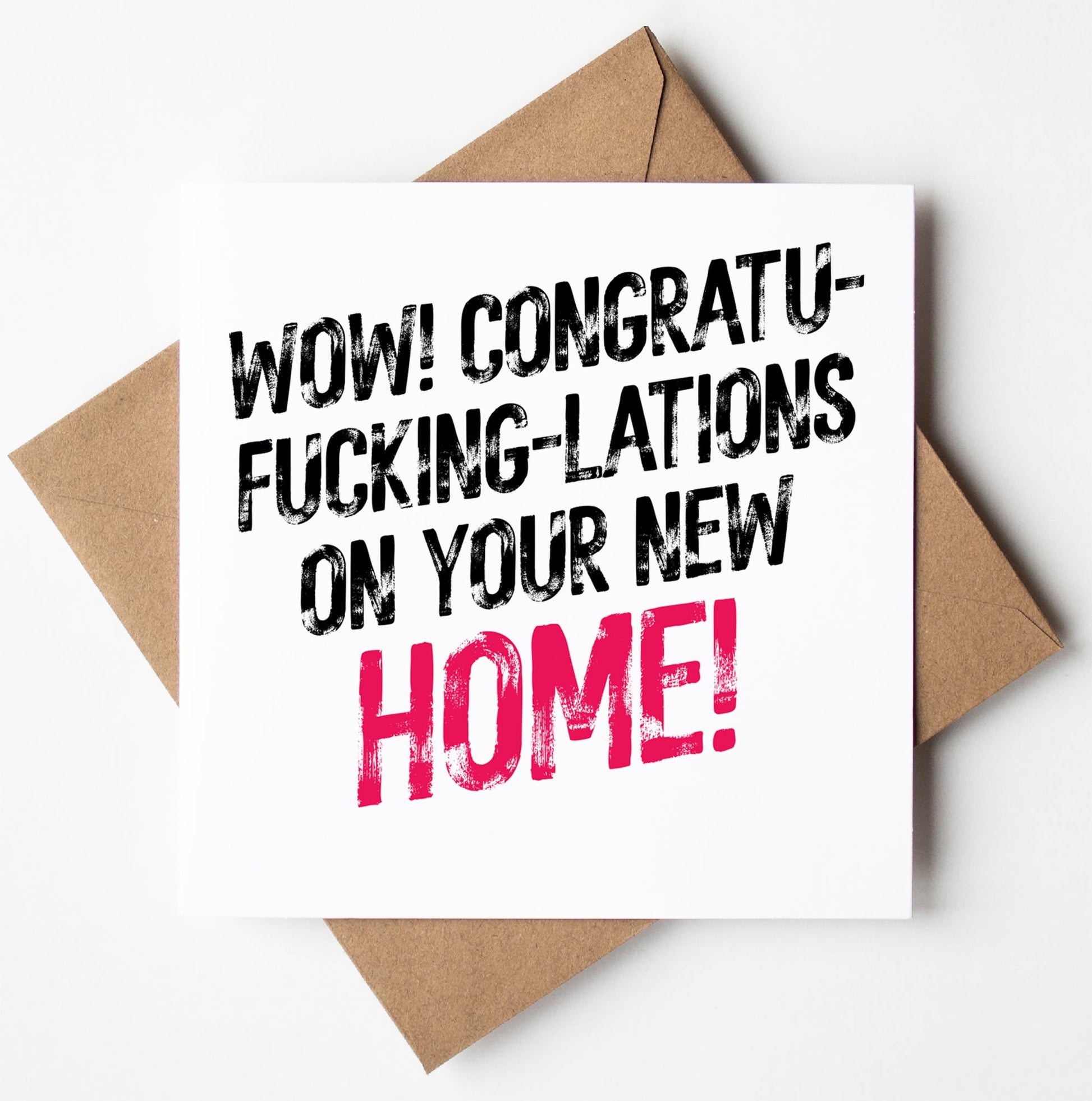 The "Congratulations On Your New Home Card" features bold text that exclaims, "Wow! Congratu-fucking-lations on your new home!" with the word "home" highlighted in pink while the rest of the text is in black. This cheeky card comes with a brown envelope.
