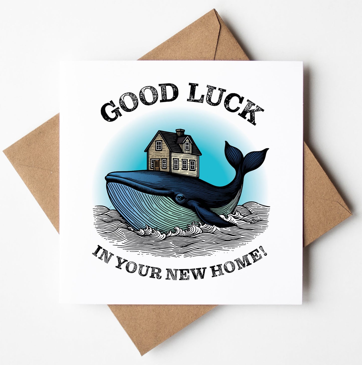 The Good Luck in Your New Home! Whale Card showcases a distinctive design of a blue whale carrying a house surrounded by swirling waves, and it comes with the message "Good luck in your new home!" This charming card is paired with a brown envelope, making it ideal for celebrating fresh starts.