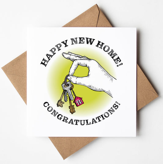 The Happy New Home! Congratulations! Keys Card features an illustration of a hand holding keys with a small red house keychain. Set against a white background, the card includes the message "Happy New Home! Congratulations!" It is designed in Wales and comes with a brown envelope.