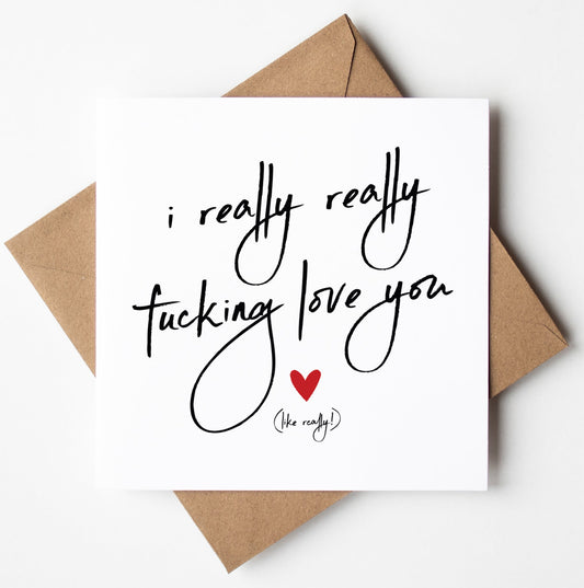 A card from the "I Really Really Fucking Love You" collection, featuring a handwritten message on a brown envelope and a small red heart—ideal for a humorous Valentine’s gesture.