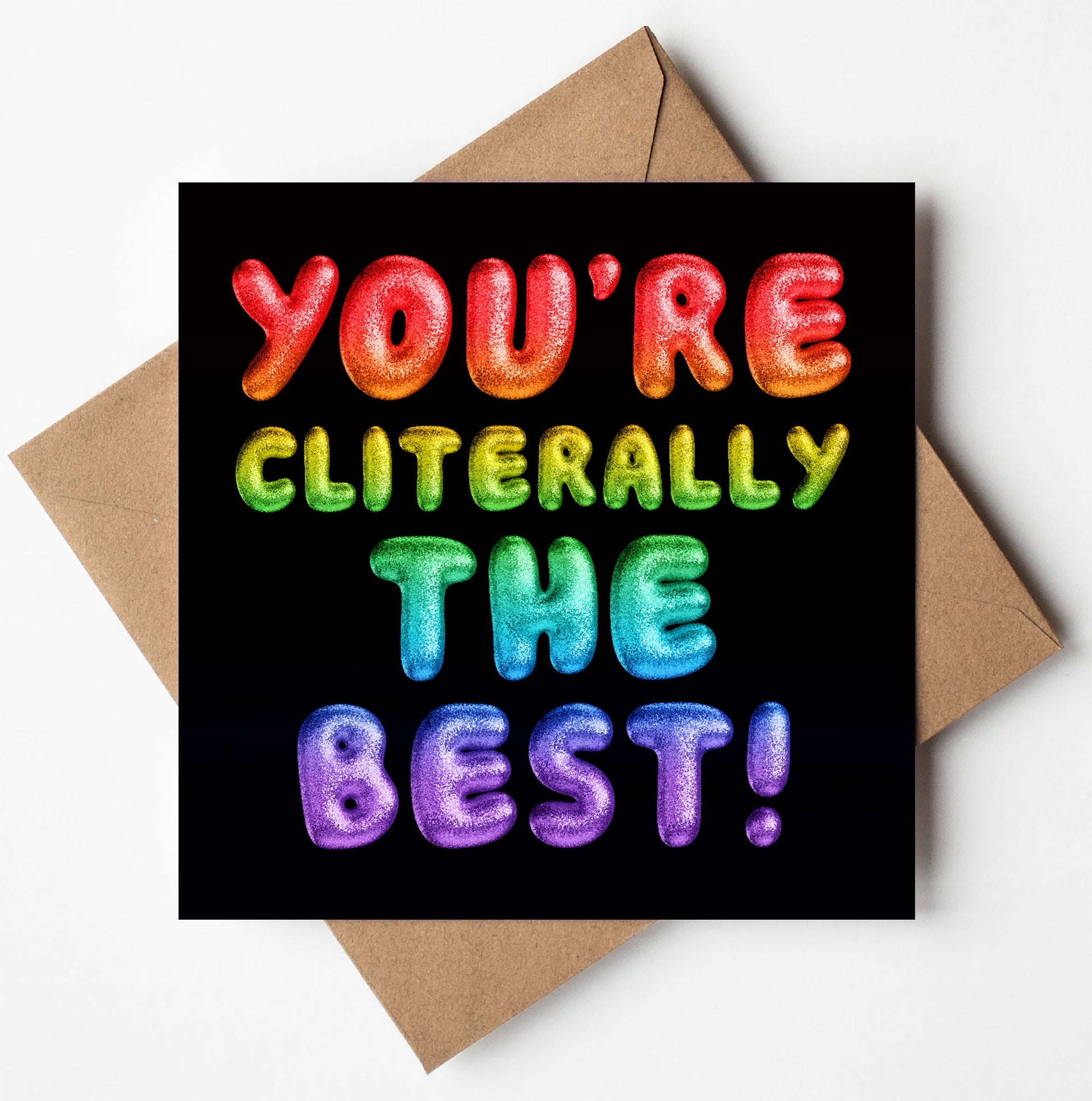 The "You're Cliterally The Best! Rainbow Font Card" features a vibrant rainbow font with puffy letters on a black background and comes with a brown envelope. It uses biodegradable materials and is available for worldwide shipping.