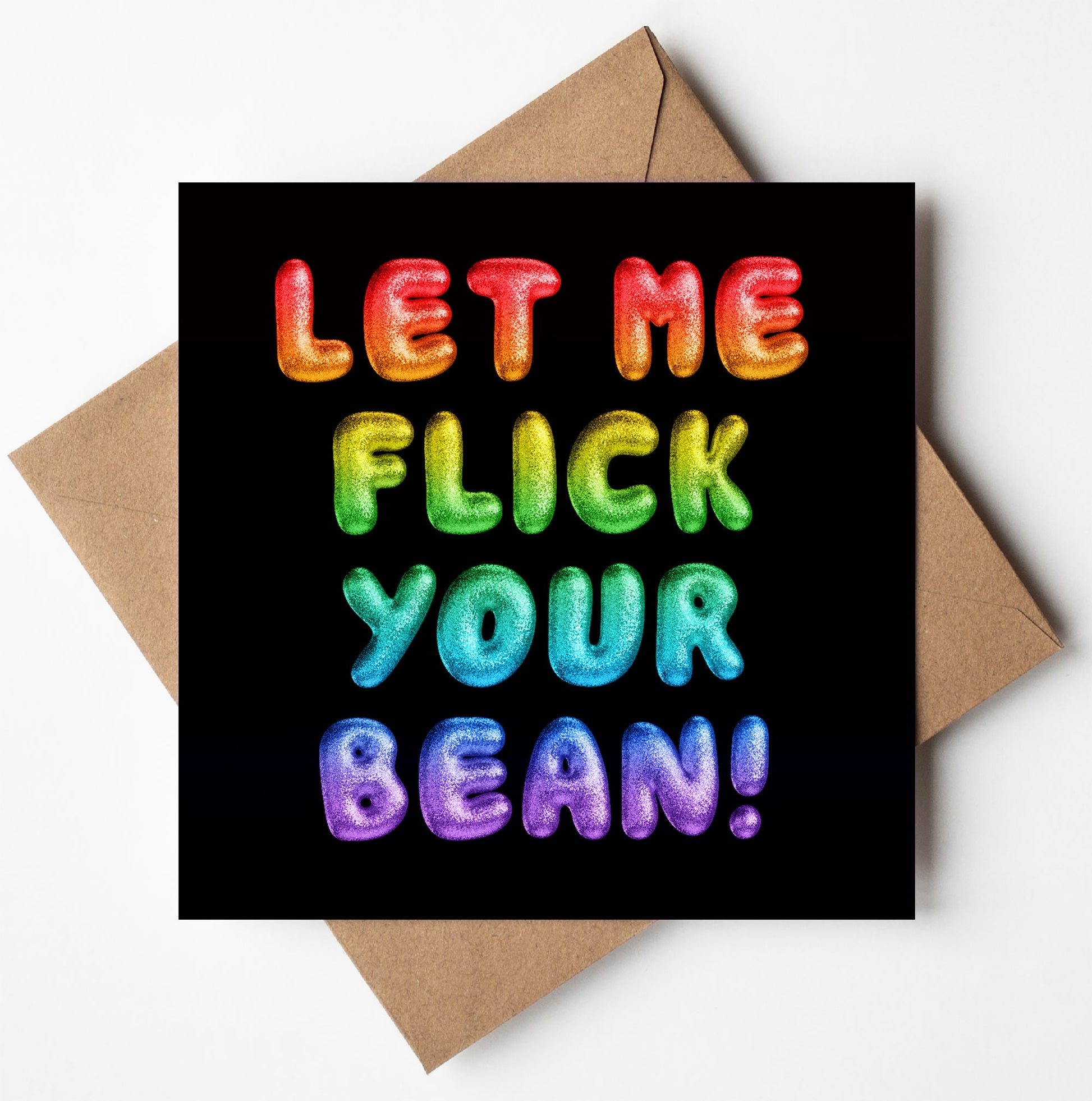 Bright, balloon-like letters spell "LET ME FLICK YOUR BEAN!" in a playful manner on the Let Me Flick Your Bean! Rainbow Font Card. Set against a black background, the message is displayed on a square card resting on a brown envelope.