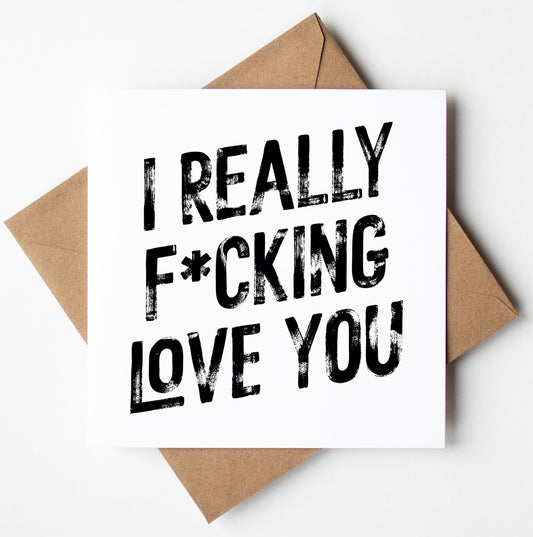 The "I Really F*cking Love You! Harlem Card" is a square, white greeting card featuring bold black text, displayed on a brown envelope against a white background.