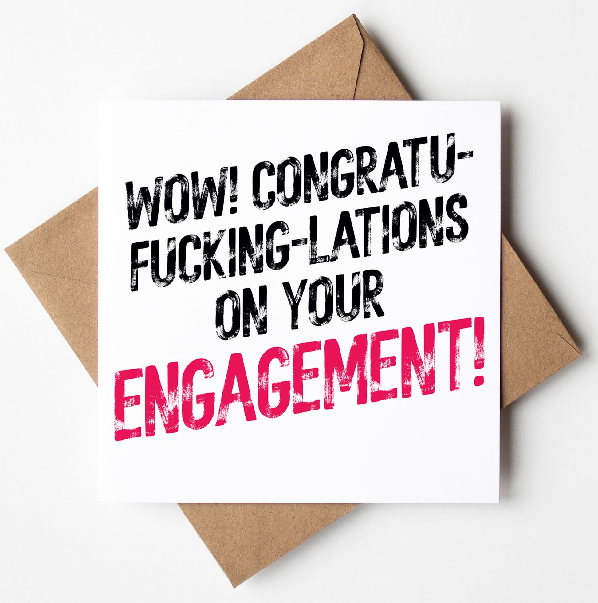 A bold and cheeky greetings card named "Congratulations On Your Engagement! Sweary Card" showcases the phrase "Wow! Congratu-fucking-lations on your engagement!" with the word "engagement" highlighted in pink, accompanied by a brown envelope.