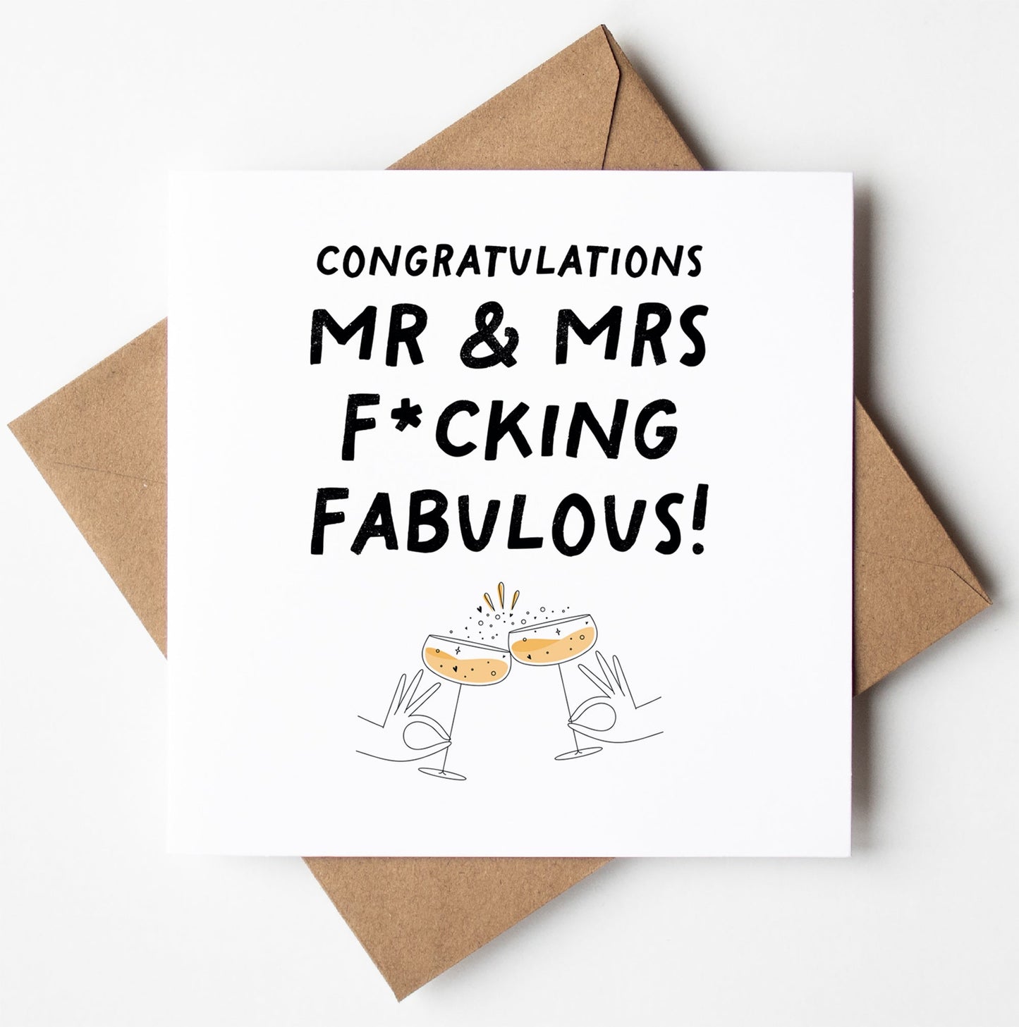 The Mr and Mrs F*cking Fabulous Wedding Card features a brown envelope, “Congratulations MR & MRS F*CKING FABULOUS!” text, hands clinking champagne glasses illustration, and offers worldwide shipping.