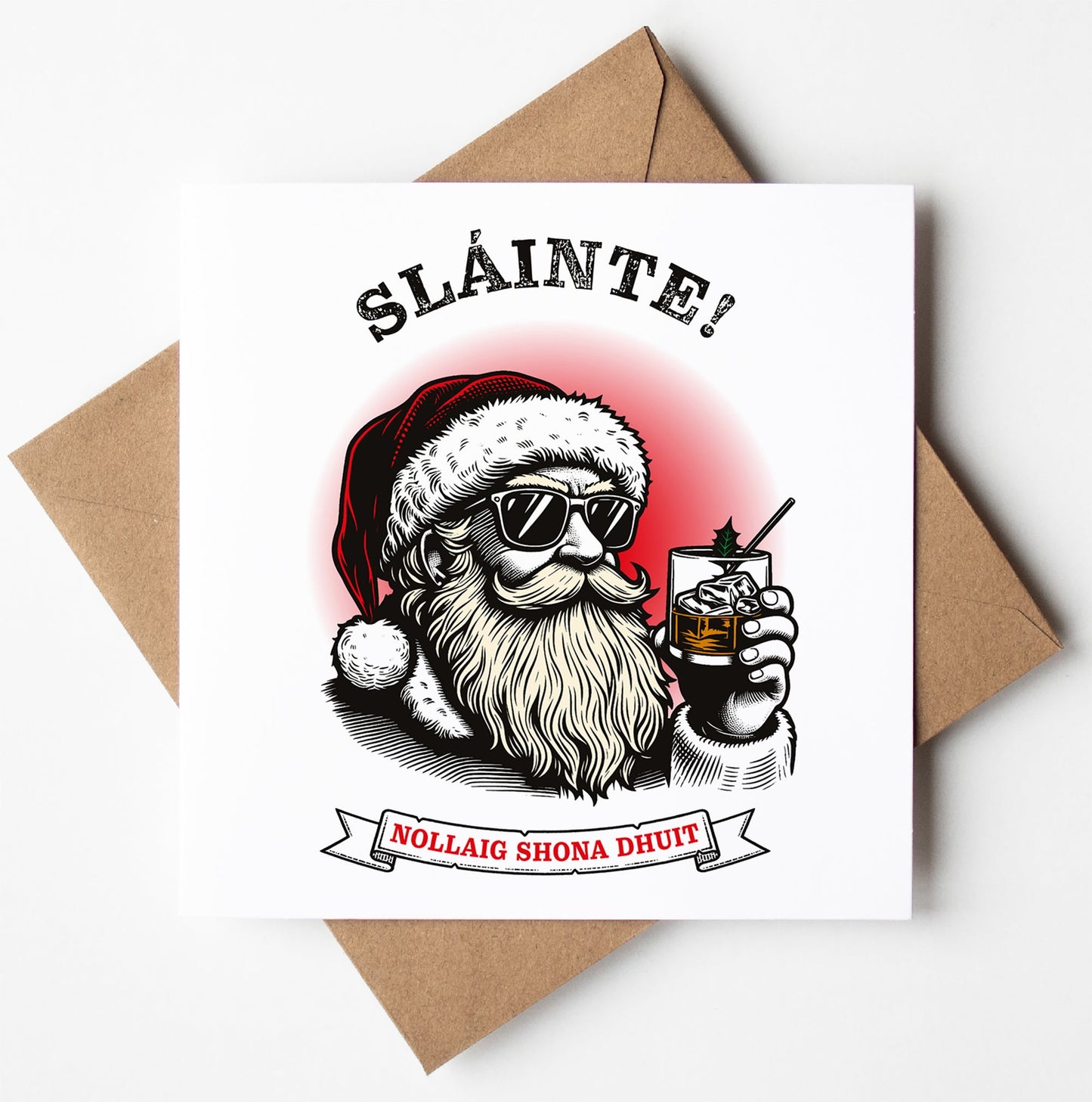 The Slàinte! Nollaig Shona Dhuit. Irish Gaelic Christmas Card features a cool, bearded Santa wearing sunglasses and a Santa hat while holding a glass of whiskey. The card includes the text "Sláinte!" and "Nollaig Shona Dhuit," and it comes with worldwide shipping in a brown envelope.